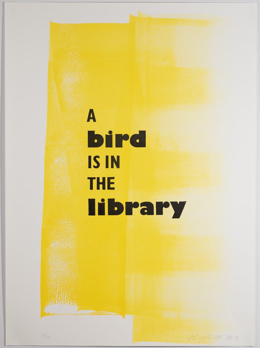 A bird is in the library